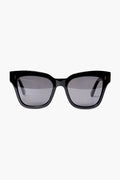 Chimi black rectangular sunglasses with thick acetate frames and dark tinted lenses provide stylish UV protection.