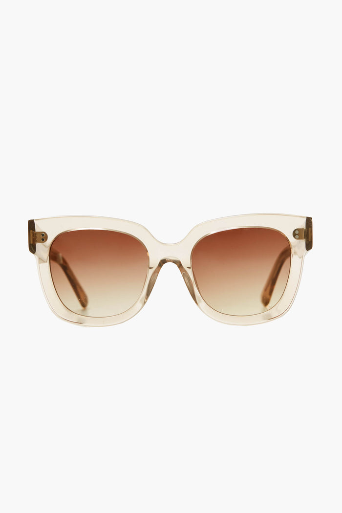 Chimi oversized square sunglasses made from Italian acetate, featuring transparent beige frames and brown gradient lenses that provide 100% UV protection.