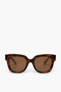 Chimi brown tortoiseshell rectangular sunglasses crafted from acetate, featuring dark lenses and reliable UV protection.