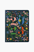 A 2023 planner by Rifle Paper Co. featuring large colorful numbers and the vibrant Mayfair Floral design.