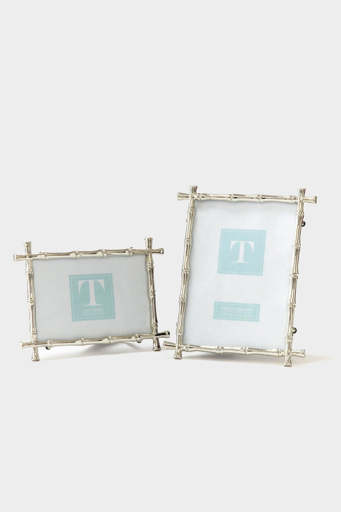 Two's Company presents two silver photo frames featuring a bamboo motif—one in a horizontal display and the other vertical—highlighting their distinctive design.