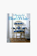Book cover for "A Passion for Blue & White" by Carolyne Roehm (Rizzoli), showing an ornate blue and white chair with gold accents—a stylish choice for fans of blue and white decor and interior design books.