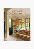 Rizzoli’s book cover for *A Place to Call Home* by Gil Schafer III showcases a bright, traditional living room with wood furniture, large windows, and fall florals—ideal inspiration for interior design and Southern home enthusiasts.
