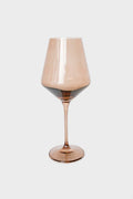 A single Estelle Colored Glass wine glass, vintage-inspired with a brown tint, wide bowl, and slender stem, expertly crafted from hand-blown colored glass.