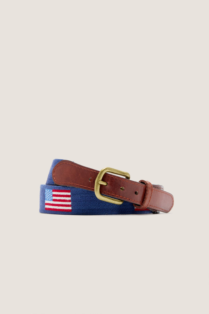 American Flag Needlepoint Belt: Classic navy-blue webbing with embroidered flag, finished in brown leather, brass buckle, exudes effortless style and high-end craftsmanship.