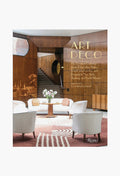 Rizzoli’s book "Art Deco" by Arnold Schwartzman features a cover with a modern interior—white chairs, spiral staircase, and round table with flowers—that reflects classic decorative styles.