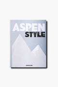 Aspen Style by Assouline features a minimalist mountain design on a light gray cover, capturing Aspen's glamour and history, with the Assouline brand at the bottom.