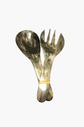 Harkiss Designs offers a large metal spoon and fork set, tied with a rubber band—unique handcrafted accessories that make perfect fair trade gifts.