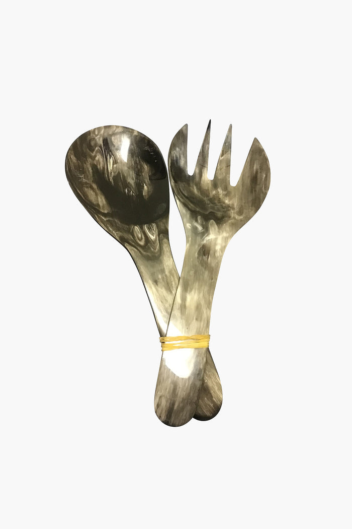 Harkiss Designs offers a large metal spoon and fork set, tied with a rubber band—unique handcrafted accessories that make perfect fair trade gifts.