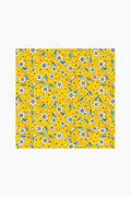 Le Cadeaux luxury melamine waterproof tablecloth with a repeating pattern of white daisies, blue leaves, and small orange dots. Stain resistant for easy care and everyday elegance.