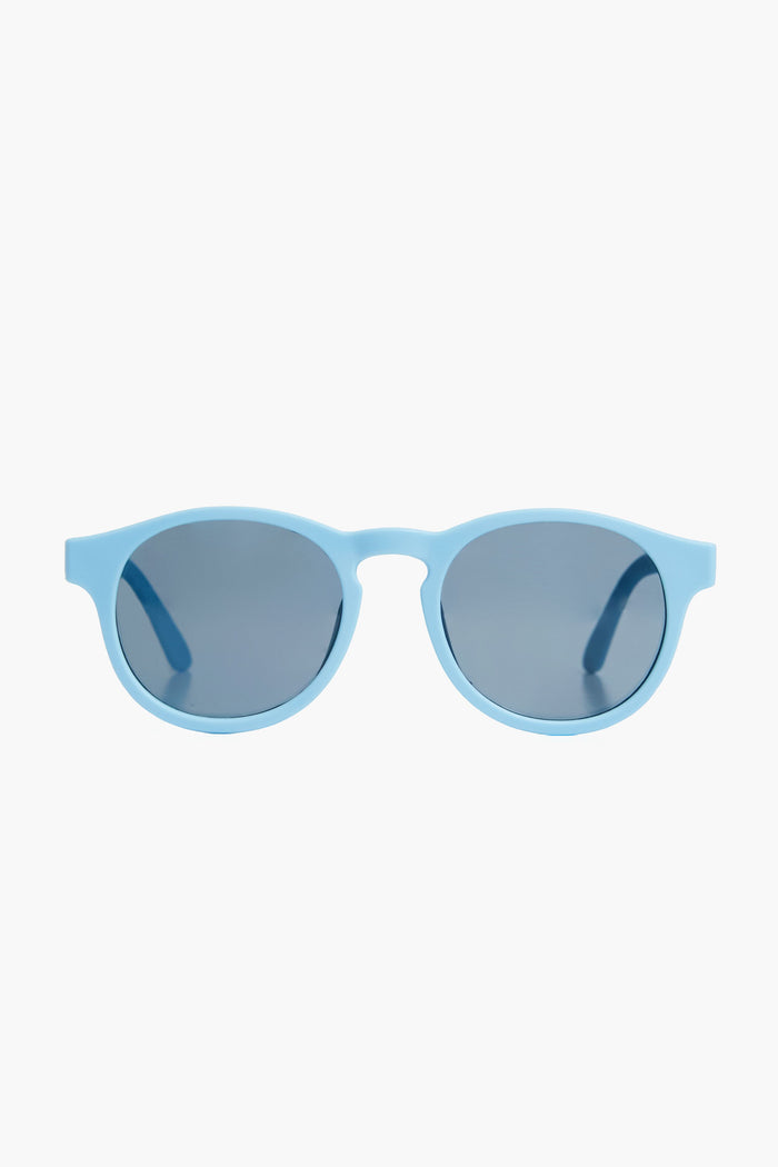 Babiators light blue round kids sunglasses feature dark tinted lenses, offering UV protection and durability.