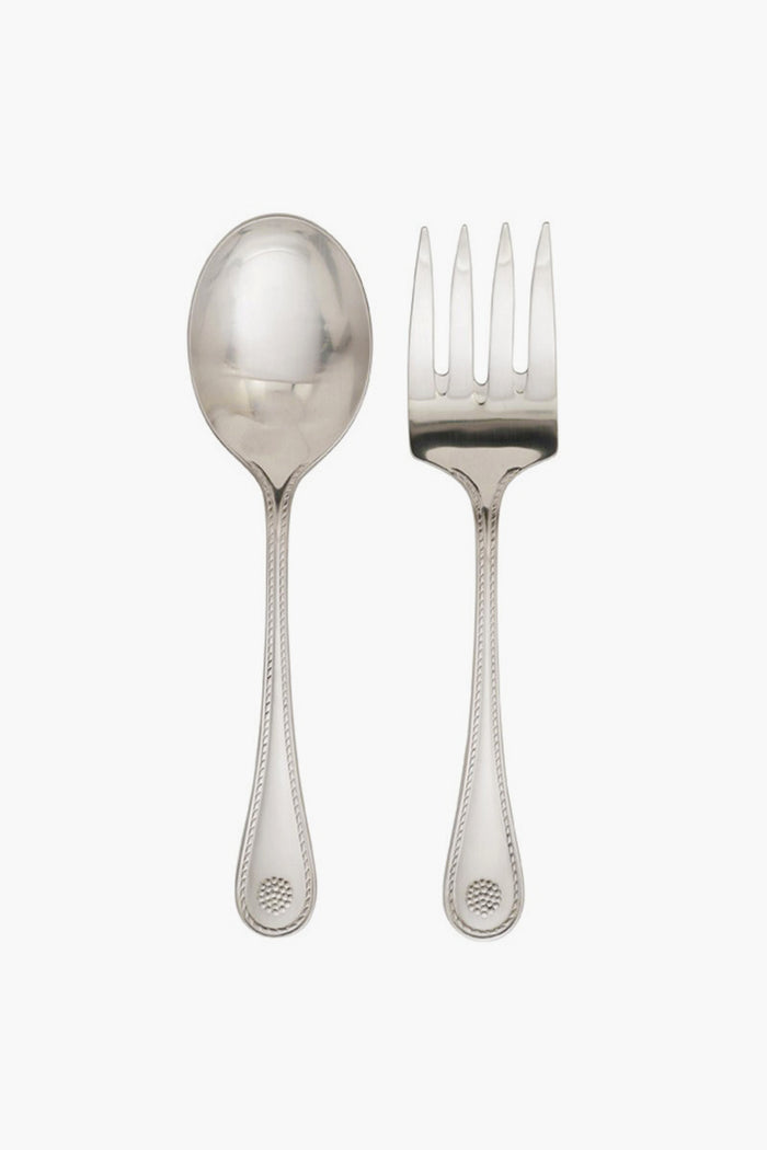 A Juliska serving spoon and matching fork with decorative thread and berry motif handles are placed side by side. Both pieces are dishwasher safe for easy cleaning.