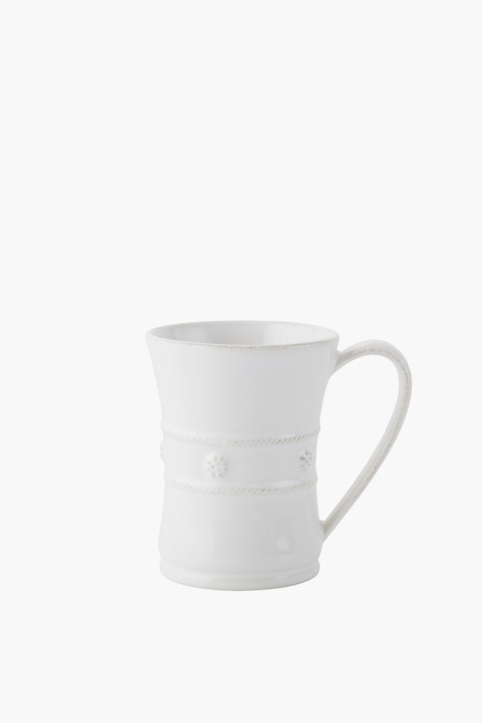A white Juliska mug crafted from ceramic stoneware features a flared rim, decorative rope-like bands, and small floral accents.