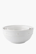 Three white ceramic stoneware mixing bowls by Juliska nest inside each other and feature a simple embossed dot and rope design along the rim—ideal for serving.