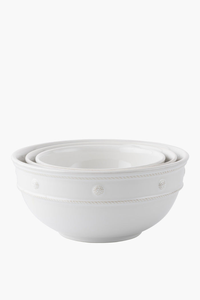 Three white ceramic stoneware mixing bowls by Juliska nest inside each other and feature a simple embossed dot and rope design along the rim—ideal for serving.