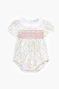 Nella Pima baby romper made from soft Peruvian Pima cotton, with short sleeves, white Peter Pan collar, floral print, and smocked chest—an adorable smocked bubble onesie.