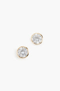 A pair of round, clear Bezel Solitaire Stud earrings by SHASHI, crafted in 18K vermeil gold-toned metal.