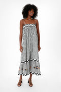 A woman wears an Oliphant fish motif dress, the perfect choice for resort wear or a vacation outfit.