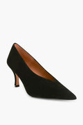 The Flattered black suede pump features a pointed toe and low stiletto kitten heel, showcasing elegant handmade craftsmanship.