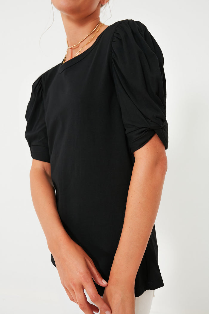Black Vesty Puff Short Sleeve Crewneck exudes classic, effortless style with its fun puffed sleeves and high-end knot tie detail, perfect for an elevated casual look.