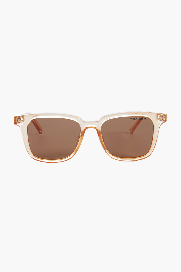A pair of Le Specs rectangular sunglasses featuring translucent beige frames and brown polarized lenses.