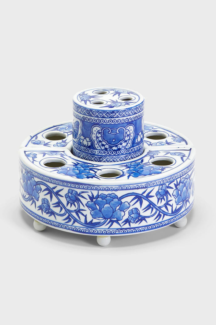 The Two's Company hand-painted porcelain vase features a blue and white floral design, perfect as a stylish arranger for creating stunning floral centerpieces.