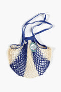 The Filt reusable French market bag features blue and cream cotton netting, sturdy blue handles, and a green product tag—perfect as a stylish shopper.