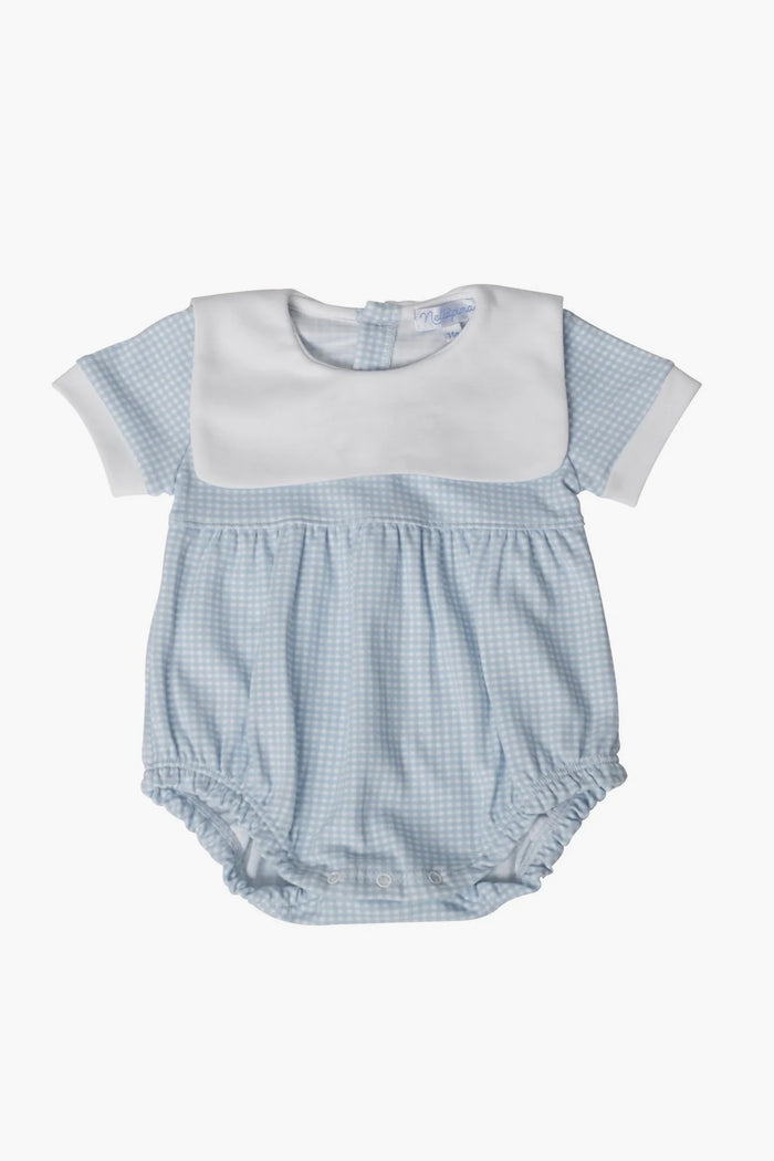 The Nella Pima Blue Gingham Bubble is a light blue baby romper made from luxurious Peruvian Pima cotton, featuring short sleeves, a white collar, and button-back closure—perfect for your little one.