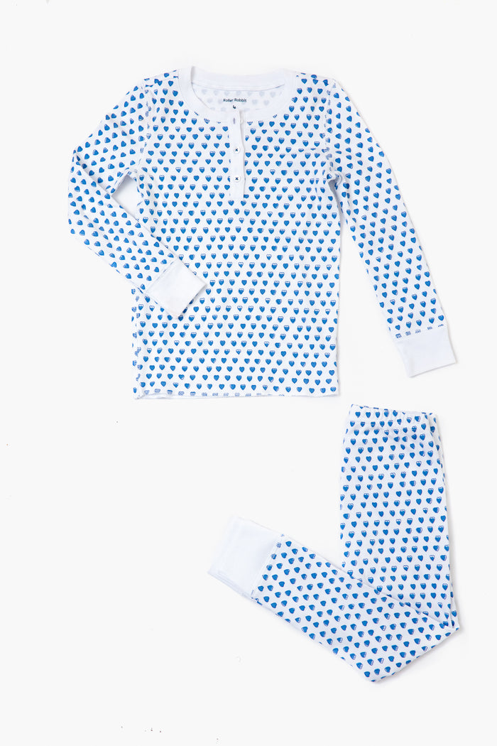 A two-piece Roller Rabbit kids' pajama set in soft Pima cotton, featuring blue hearts, long sleeves, a buttoned neckline, and matching pants, shown laid flat on a white surface.