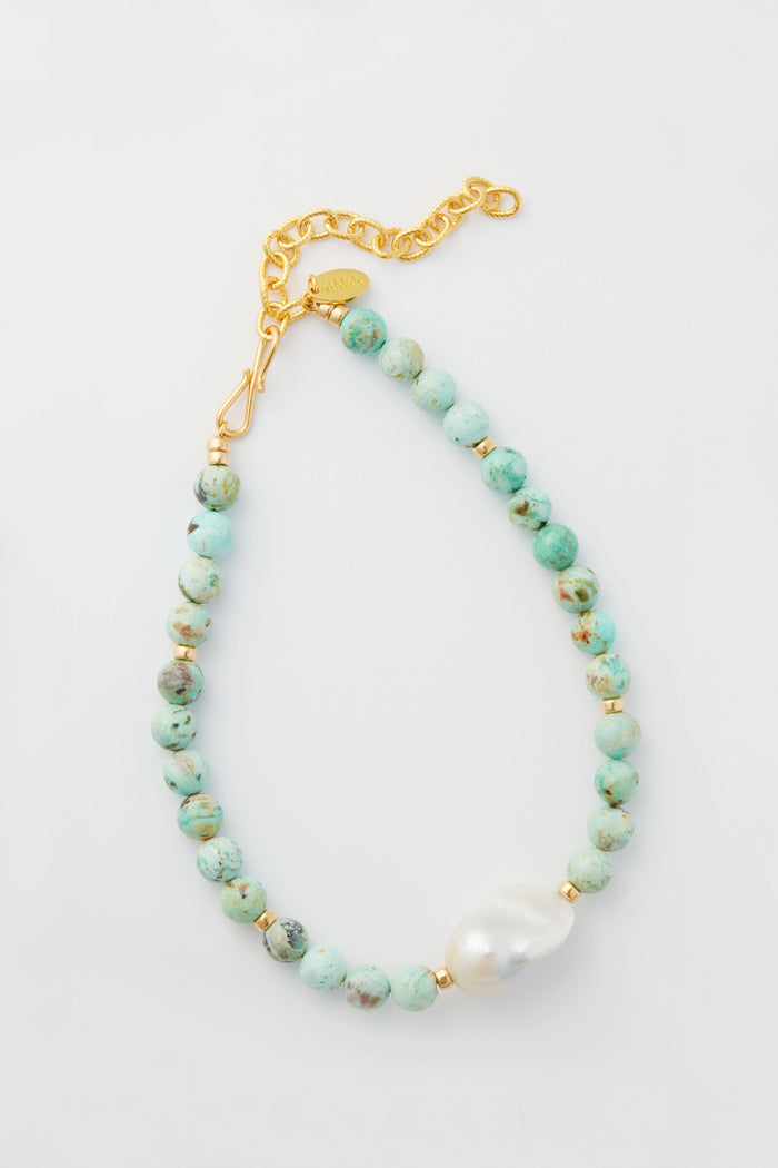 Lizzie Fortunato bracelet featuring round turquoise beads, a single large freshwater pearl, and a gold chain clasp.