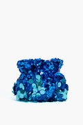 The Olga Berg small blue drawstring pouch features shiny blue and turquoise sequins—ideal as a clutch for special occasions or an evening bag.