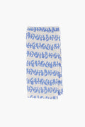 A folded white Modafleur cloth with blue leaf-patterned horizontal stripes, ideal as blue vine napkins or tabletop linens for any dining setting.