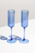 Two FAZEEK Blue Wave Flutes, crafted from borosilicate glass, stand side by side on a white surface with soft shadows behind them.