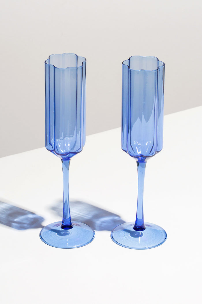 Two FAZEEK Blue Wave Flutes, crafted from borosilicate glass, stand side by side on a white surface with soft shadows behind them.