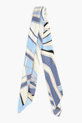 A Cult Gaia silk scarf featuring a geometric abstract print in blue, cream, and black.