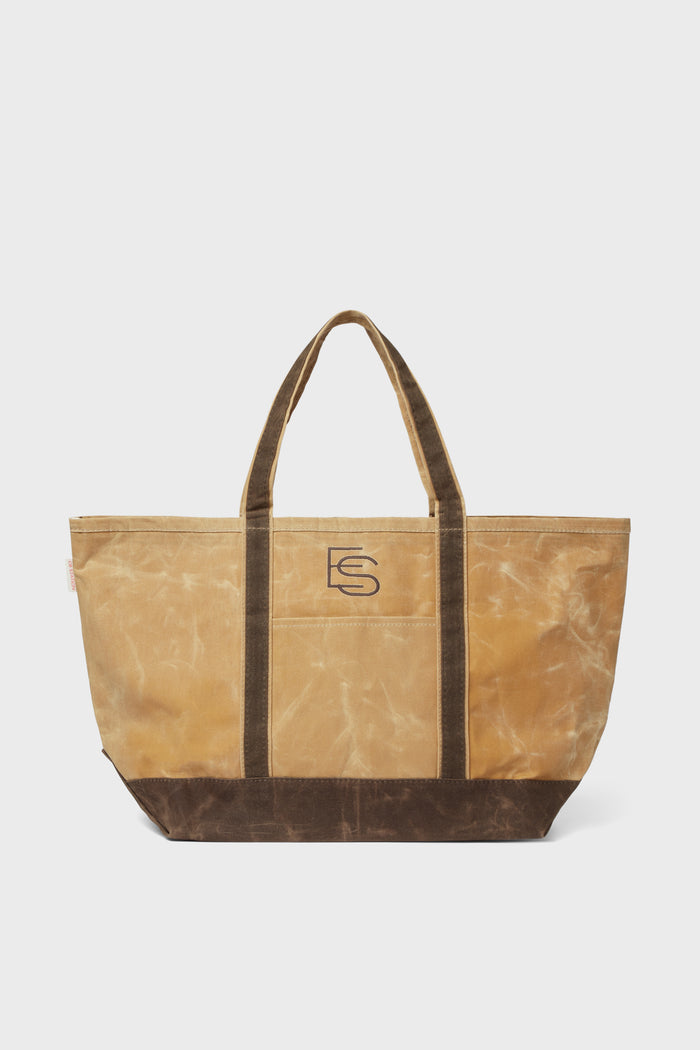 Large tan and brown canvas bag by CB Station with two handles and ES logo on the front, perfect as a personalized tote for everyday use.