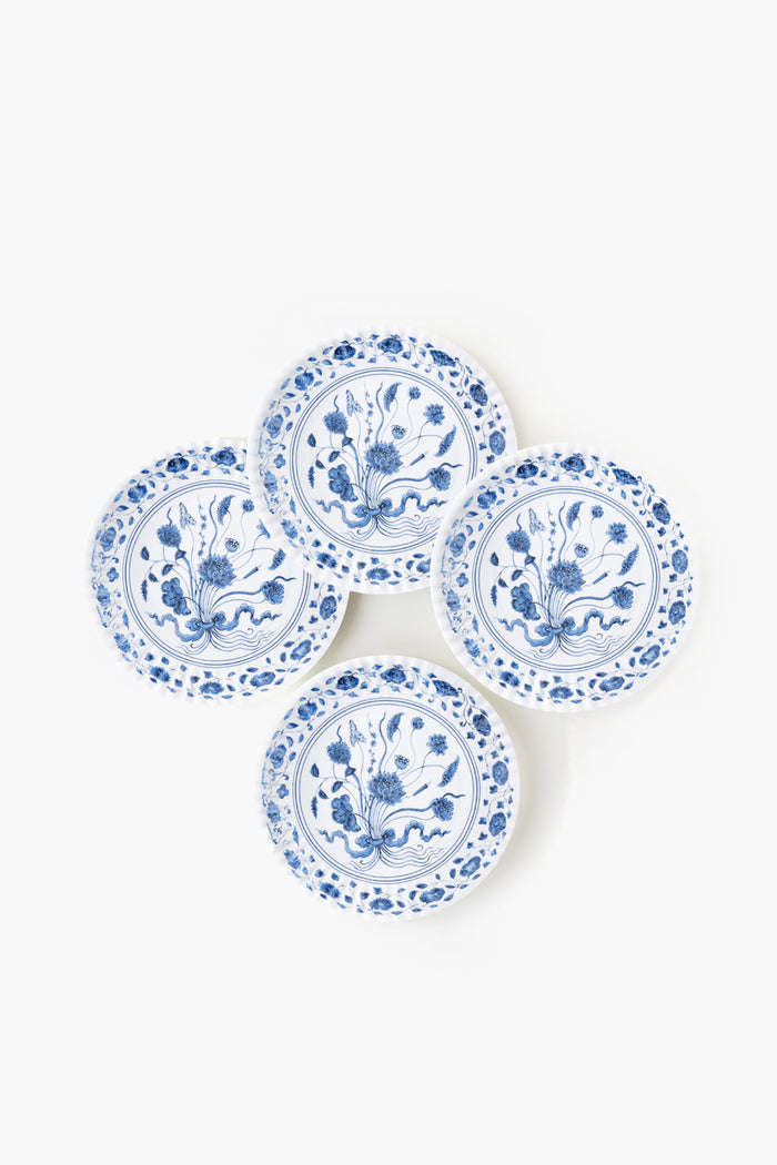 Four round white botanical plates by One Hundred 80 Degrees feature blue floral patterns and are arranged in a slightly overlapping cluster. Made from melamine, these plates combine style with dishwasher-safe convenience.