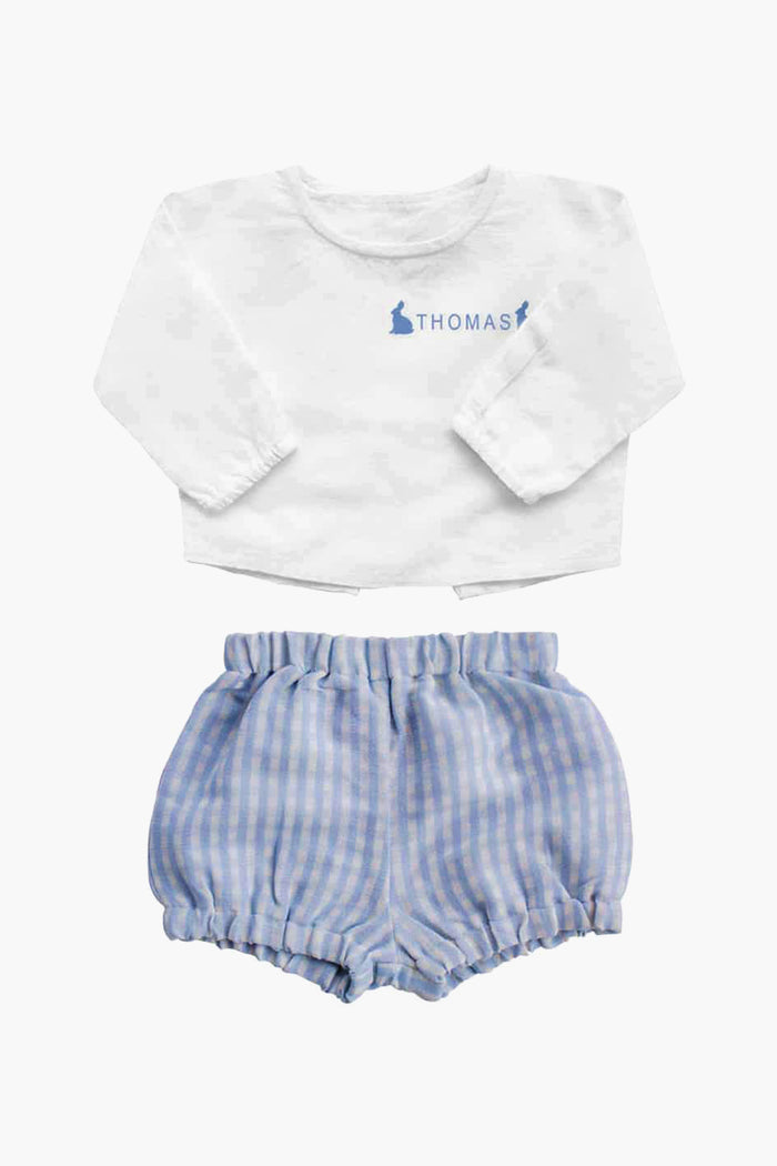 A delightful Louelle. baby gift: a boys’ set with a white long-sleeve top featuring "Thomas" and blue bunny prints, paired with classic blue and white gingham shorts.