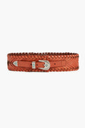 The B-Low the Belt wide brown braided leather belt features a silver buckle, tip, and decorative accents. Displayed horizontally, this western-style accessory adds a stylish touch to any outfit.