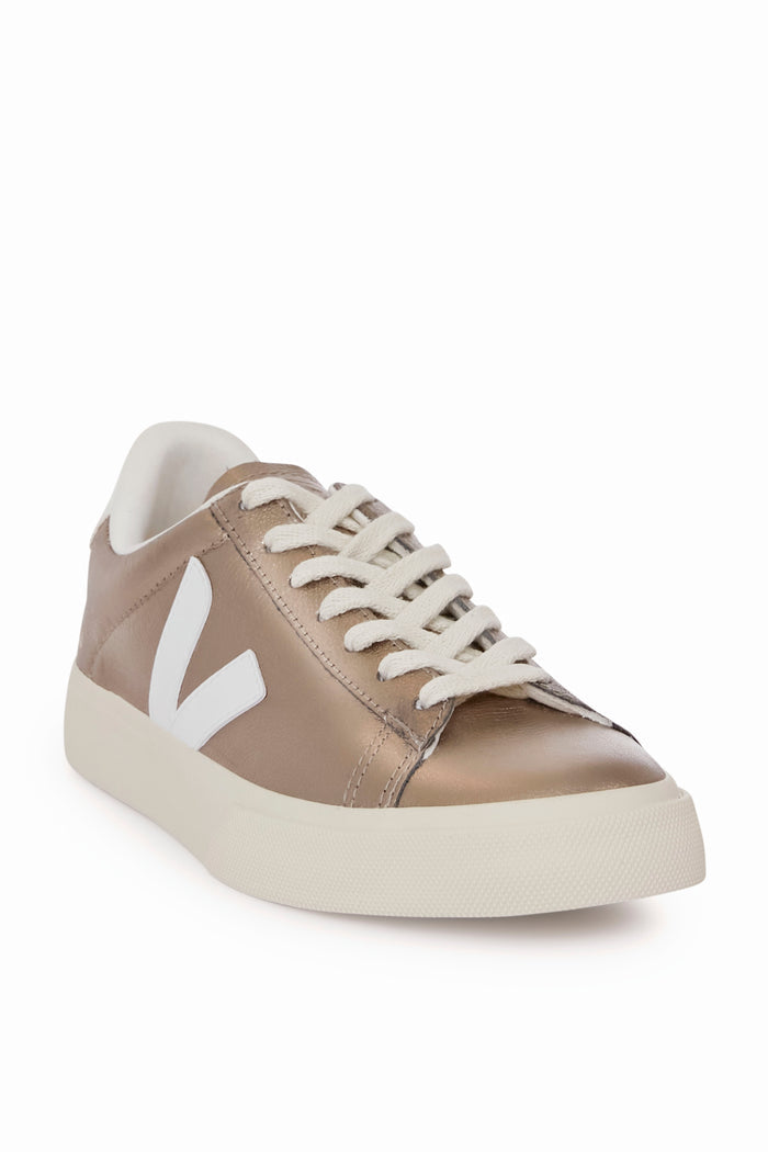 A bronze metallic low-top sneaker by VEJA featuring white laces, a white sole, and a prominent white V logo on the side.