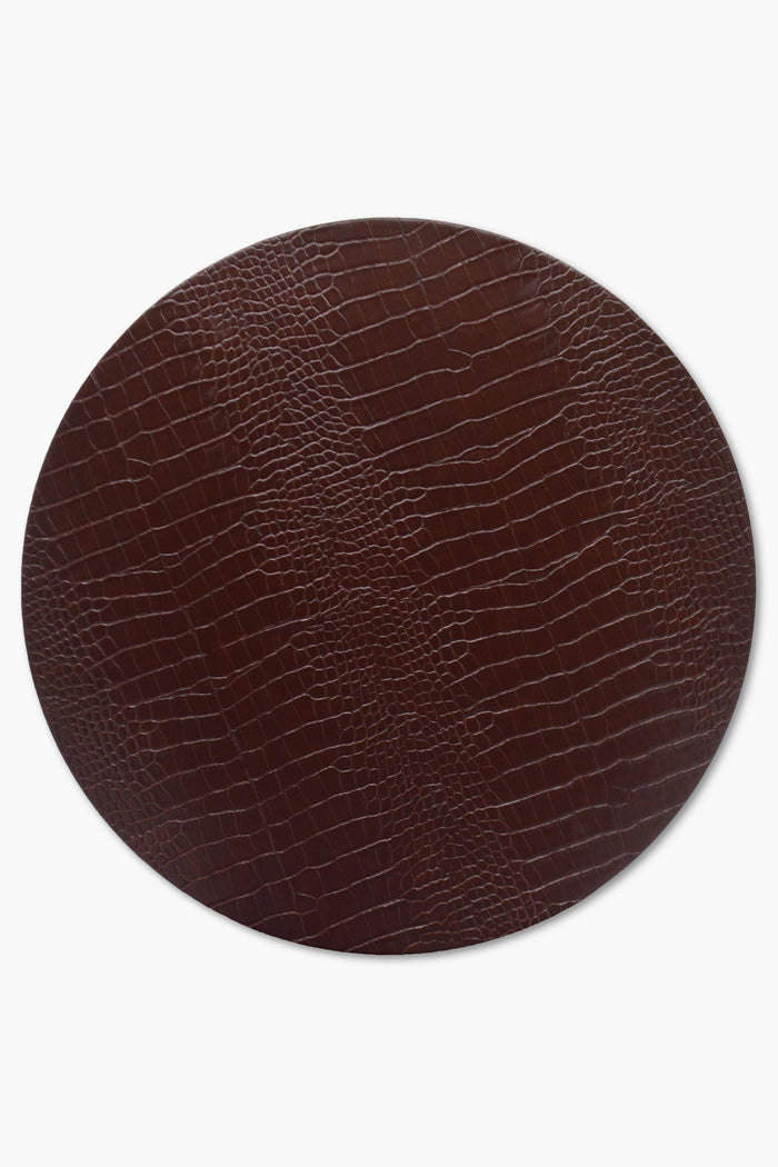 Chefanie's oval brown placemat features a textured, reptile-skin-inspired pattern—ideal for adding elegance and sophistication to your neutral tablescape.