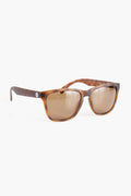 A pair of Sunski Madronas sunglasses features rectangular frames and brown-tinted, polarized lenses that provide 100% UV protection.