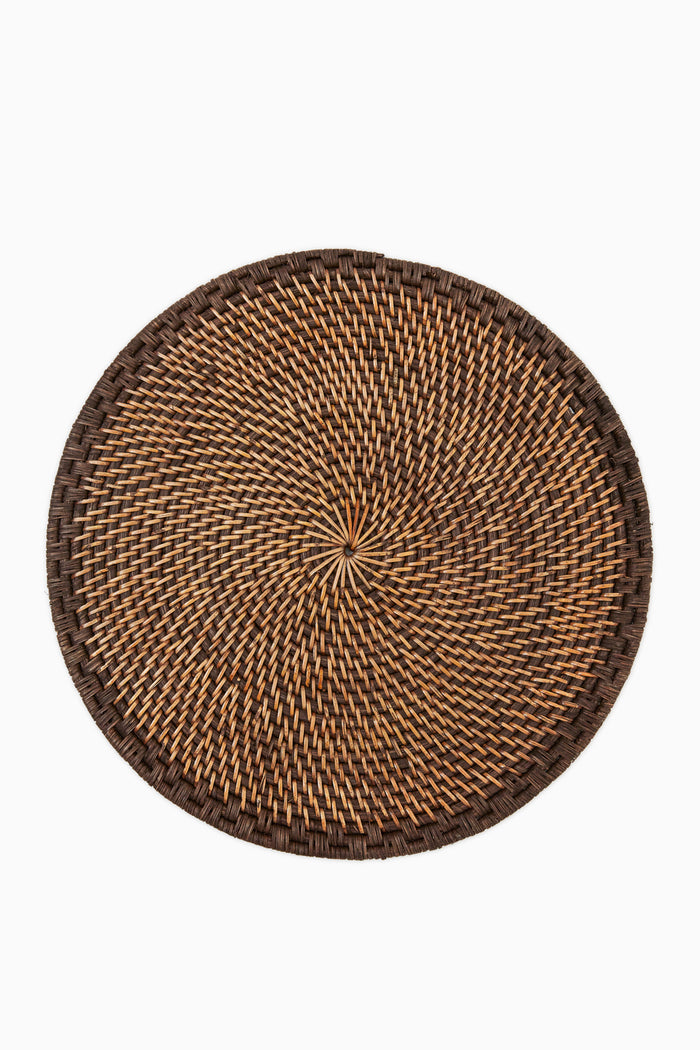 Caton's Wharf round woven rattan placemat features a brown and tan pattern, crafted in natural tones.