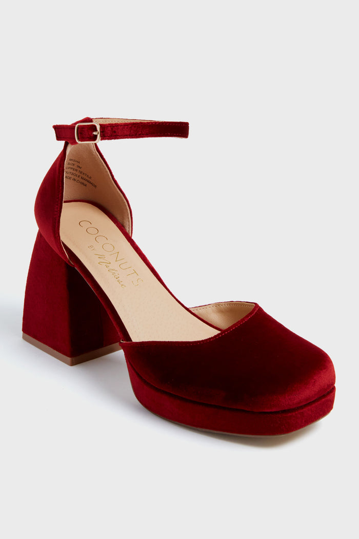 The Matisse red velvet block-heeled Mary Jane features an ankle strap and closed round toe—a chic choice for fans of stylish velvet heels.