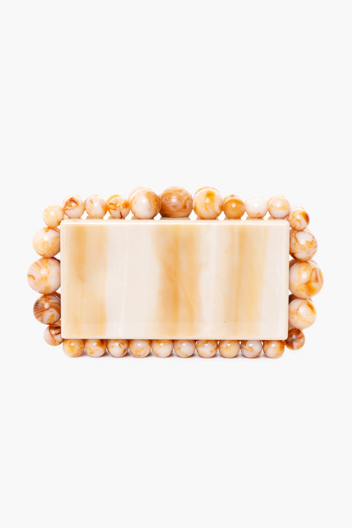 Beige marbled rectangular box clutch by Cult Gaia, featuring round tan and cream acrylic pearl beads—an elegant accessory for any occasion.