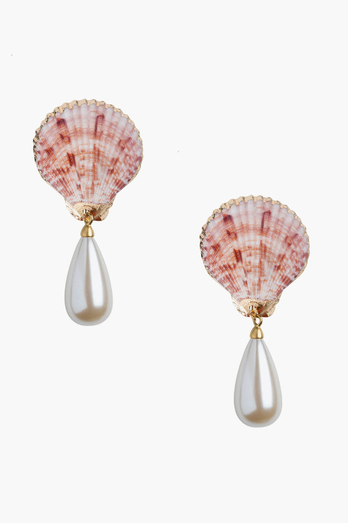 These Neely Phelan scallop shell earrings feature pink tops and teardrop-shaped white pearls, adding a touch of beach-inspired elegance to any outfit.