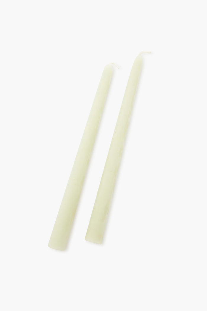 Two plain, unlit Greentree Home pure beeswax candles placed side by side make a thoughtful housewarming gift.