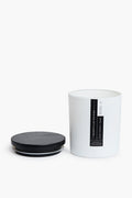 A white cylindrical container with a black removable lid beside it, featuring a vertical "Jasmine Cycle" label. This natural candle by The Nashville Chicks Candle Co. is made from hypoallergenic coconut soy wax.