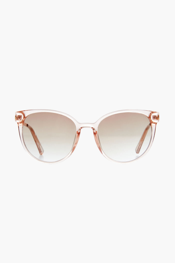 Le Specs pink translucent cat-eye sunglasses with gradient lenses offer a vintage round vibe.