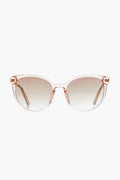 Le Specs pink translucent cat-eye sunglasses with gradient lenses offer a vintage round vibe.